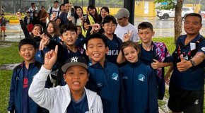 Swimming student competitors arrive at competition