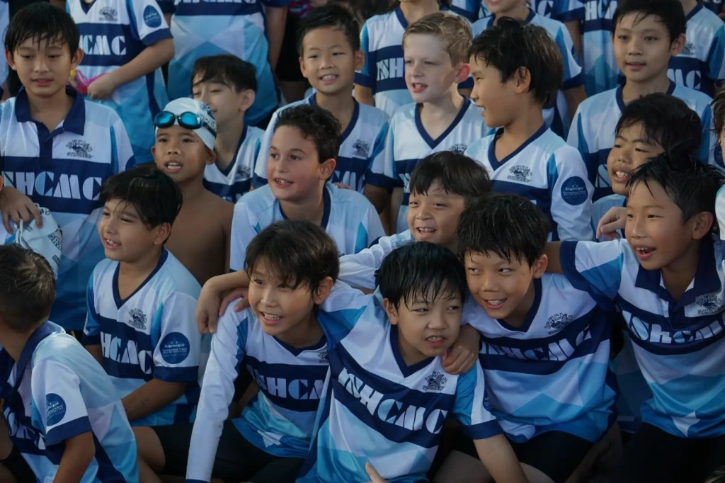 Hwan (fourth from the right in the front row) has proudly been a Stingray since his early days at ISHCMC.