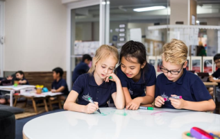Pictured are three students studying
