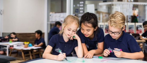 Pictured are three students studying