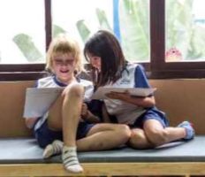 two girls reading